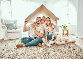 Image showing Happy family, portrait and cardboard roof for moving in, property investment or real estate at new home. Mother, father and kids smile for shelter, apartment or relocation together on house mortgage