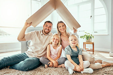 Image showing Happy family, portrait and cardboard roof for real estate, moving in or property investment at new home. Mother, father and kids smile for shelter, apartment or relocation together on house mortgage