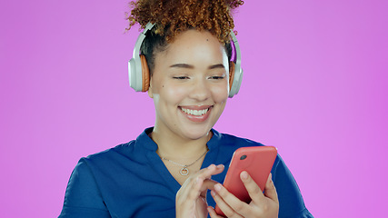 Image showing Headphones, happy and woman with phone in studio listening to song, audio and radio. Music, smile and face of person with smartphone for streaming subscription, relax and fun on purple background