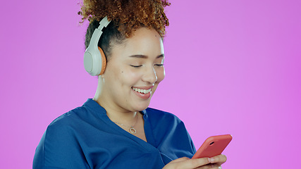 Image showing Headphones, music and woman with phone on purple background listening to song, audio and radio. Happy, smile and face of person with smartphone for streaming subscription, relax and fun in studio