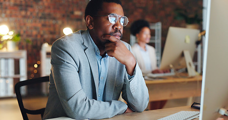 Image showing Business man, thinking and ideas on computer for office startup, financial decision and planning or solution at night. African worker for accounting research, web analysis and desktop problem solving