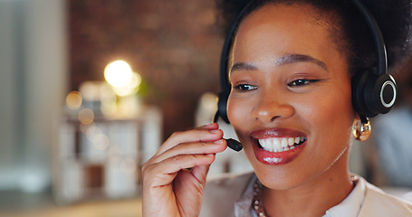 Image showing African woman, call center and night in office, talk and smile for telemarketing, voip mic or contact us. Consultant, crm and tech support agent with customer service, thinking or advice at help desk
