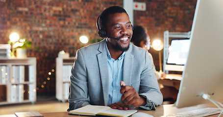 Image showing African man, call center and computer in office, talk and night for telemarketing, voip mic and contact us. Consultant, crm and tech support agent for customer service, idea or questions at help desk