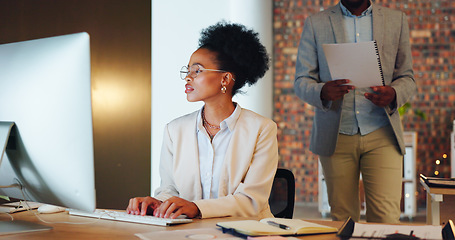 Image showing Business woman, office and computer for marketing report, social media management and online editing at night. Professional african writer, editor or worker typing on desktop for copywriting research