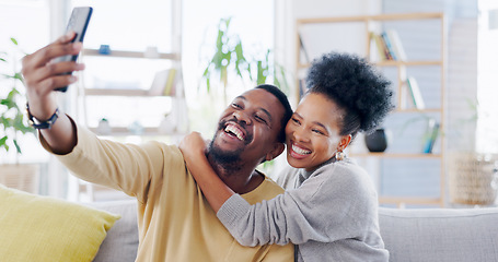 Image showing Black couple, selfie and smartphone at home, smile and living room, happiness and couch. Quality time, bonding and romance with man, woman and relationship for memories, social media and dating