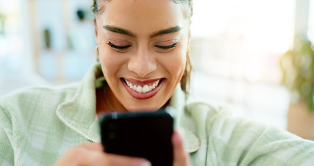 Image showing Happy, typing and woman with phone on sofa in home, living room or apartment with internet communication to contact us. Funny, meme or video on social media and person chat online with cellphone