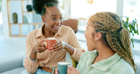 Image showing Happy, talking and women with coffee on the sofa for gossip, secret or conversation in a house. Excited, relax and a black woman with a girl or friends with communication, tea and story on the couch