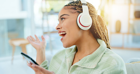 Image showing Phone, singing and happy woman on music headphones in home living room. Smartphone, dance and excited African person listening to radio, audio and sound for freedom, celebration and streaming online