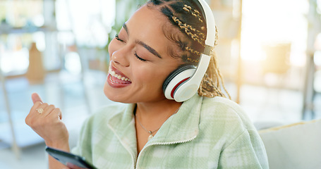 Image showing Phone, dance and happy woman on music headphones in home living room. Smartphone, radio and excited African person listening to podcast, audio and sound for freedom, celebration and streaming online