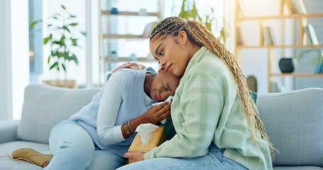 Image showing Depression, empathy and support with black woman friends on a sofa in the living room of a home together. Sad, mental health and a young person crying into a tissue during loss, pain or grief