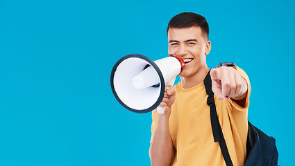 Image showing Megaphone, mockup and portrait of man in studio pointing for announcement, speech or rally. Smile, protest and male student from Canada with bullhorn for communication isolated by blue background.