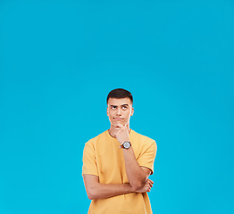 Image showing Thinking, mockup and young man in studio with decision, brainstorming or solution expression. Problem solving, idea and male model from Canada with reflection, memory or question by blue background.