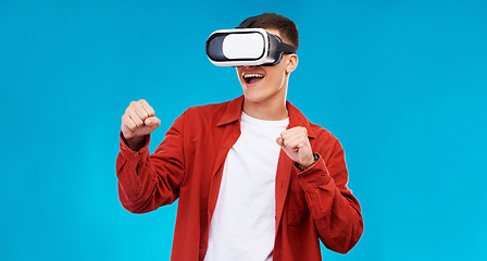 Image showing Man, virtual reality and boxing with gaming and metaverse, esports and UX with software on blue background. Futuristic, 3D and technology with digital world, mockup space and challenge in studio