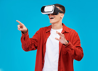 Image showing Man, virtual reality and futuristic glasses for e learning, software or student wow for vision on a blue background. Excited person press in 3d video, VR technology and metaverse education in studio