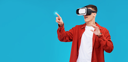 Image showing Man, press and VR or futuristic glasses for education, 3d software or gaming in studio metaverse. Student in virtual reality, touch glow and fingerprint hologram on a blue background and banner space