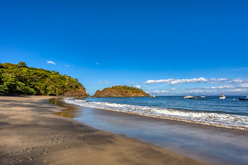 Image showing Playa Ocotal and Pacific ocean waves on rocky shore, El Coco Costa Rica