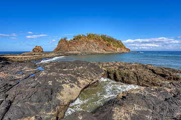 Image showing Playa Ocotal and Pacific ocean waves on rocky shore, El Coco Costa Rica