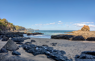 Image showing Playa Ocotal and Pacific ocean waves on rocky shore, El Coco Costa Rica