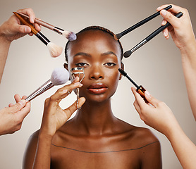 Image showing Tools, hands and portrait of black woman and cosmetics for getting ready, beauty product and glow. Brush, group and people with equipment for an African model, makeup and artist application in studio