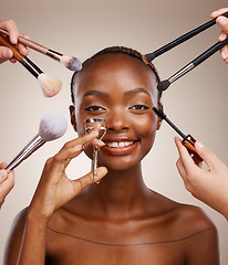 Image showing Tools, hands and portrait of black woman and makeup for getting ready, beauty product and glow. Happy, group and people with equipment for an African model, cosmetics and artist application in studio