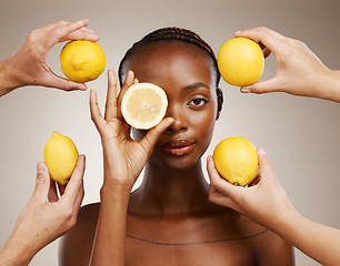 Image showing Hands, lemon and natural beauty, black woman in portrait for wellness and sustainable skincare on brown background. Health, nutrition and fruit, dermatology and vegan product with vitamin c in studio