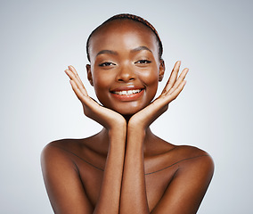 Image showing Portrait, smile and beauty with skincare and black woman in studio on a gray background for touch or natural wellness. Frame, spa or luxury and a young model with cosmetic or antiaging treatment