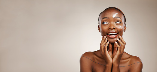 Image showing Beauty, smile and black woman with skincare, cream and wellness on a grey studio background. African person, girl or model with creme, aesthetic or cosmetics with happiness, mockup space or self care