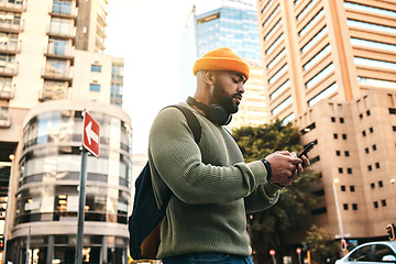 Image showing City, phone and man typing, walking and check email, mobile communication or app notification on morning journey. Smartphone, connectivity and person contact social media user on street, road or trip