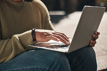 Image showing Computer, hands and closeup of man typing in the city working on a freelance creative project. Technology, email and male freelancer doing research for planning on a laptop by stairs in an urban town