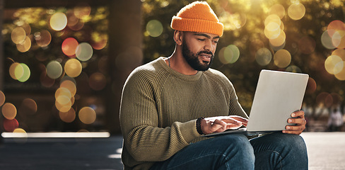 Image showing Student, man and computer at outdoor campus for university, college and scholarship research or studying in park. African person on laptop streaming for online education, website or e learning banner