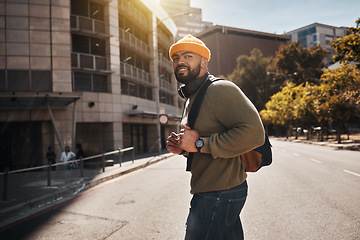 Image showing City, happiness and man travel, walking and smile for relax morning, outdoor journey or wellness. Urban buildings, sunshine and happy student, pedestrian or person commuting on street, road or trip