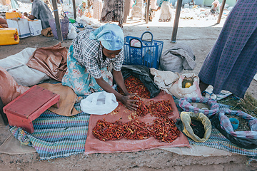 Image showing Woman sell hot chili peppers on street market in Mojo, Ethiopia