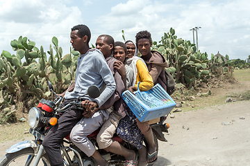 Image showing Ordinary people, family travel on bike in Ethiopian countryside.