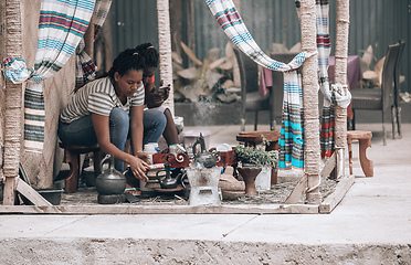 Image showing Women preparing traditional bunna coffee, Jinka, Ethiopia