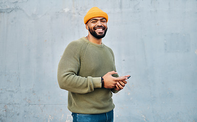 Image showing Phone, smile and portrait of man by wall networking on social media, mobile app or the internet. Technology, happy and person from Colombia scroll on website with cellphone in city by gray background