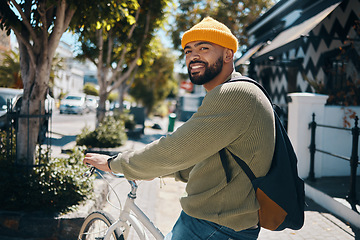 Image showing Bicycle, fashion and portrait of man in city for commute, adventure and journey in urban town. Fashion, style and happy person on bike for eco friendly transport, carbon footprint and cycling in road