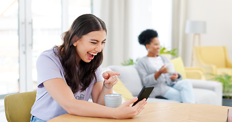 Image showing Phone, video call and young woman in the living room laughing in conversation at home. Smile, technology and happy female person on virtual discussion with cellphone by table in modern apartment.