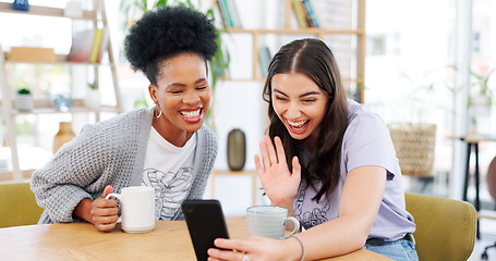 Image showing Girl friends, video call and phone in coffee shop, wave and excited for conversation, talk and contact. Women together, smartphone and smile for communication, social media app and relax with tea cup