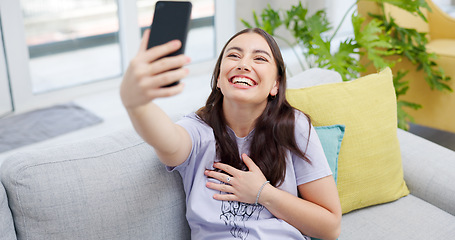 Image showing Woman, selfie and sofa with smile, home and happy for post on web blog, internet and relax in living room. Influencer girl, excited and photography for memory, profile picture and social network app