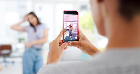 Image showing Phone, woman and influencer recording video for social media, vlog or online post dancing at home. Hands, cellphone and female content creator live streaming and moving to music in living room.