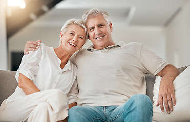 Image showing Happy senior couple, portrait and hug on living room sofa in relax, embrace or love for support at home. Mature man and woman smile in retirement, trust or affection on lounge couch for care at house