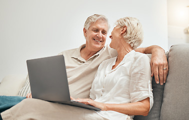 Image showing Senior, couple and online shopping with laptop on sofa in home living room with ecommerce, promotion or online deal. Old people, search and shop on internet or relax with computer in lounge together