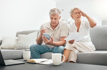 Image showing Frustrated senior couple, documents and debt on living room sofa in financial crisis, expenses or bills at home. Mature man and woman checking finance, paperwork or budget with calculator for invoice