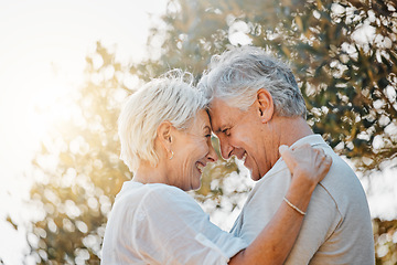 Image showing Senior couple, forehead or hug in nature garden for love, support or bonding retirement trust. Woman smile, lens flare or elderly man in embrace for relationship, connection and together in backyard