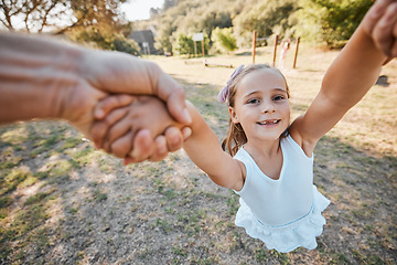 Image showing Happy, pov and hands swing child outdoor in garden, park or game in nature with parent. Girl, face and dad or mom swinging kid for crazy, fun or bonding in summer, vacation or backyard games