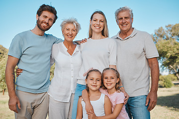 Image showing Nature portrait, hug and happy family children, parents and senior grandparents enjoy reunion with mom, dad and kids. Park, love and relax people bonding, care and embrace young sisters in Australia