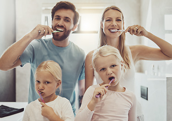 Image showing Portrait, family and brushing teeth with girl children in the bathroom for learning about oral hygiene. Mother, father and sister kids together in their house for dental care education in the morning