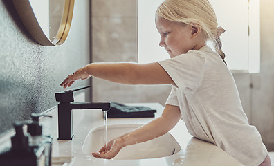 Image showing Bathroom, water and child washing hands with soap, tap and healthy hygiene in morning. Cleaning dirt, germs and bacteria on fingers, small girl in home for wellness, safety and skin care in apartment