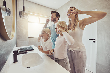 Image showing Smile, family and brushing teeth with girl children in the bathroom for learning about oral hygiene. Mother, father and sister kids together in their house for dental care education in the morning