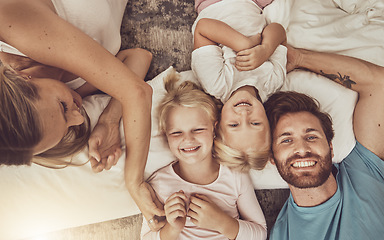 Image showing Happy family, children and parents in bedroom, morning and smile with tickle, play or fun. Bed, laugh and funny with mom, dad or girls in bedroom, home or bonding in top view, playful or affectionate